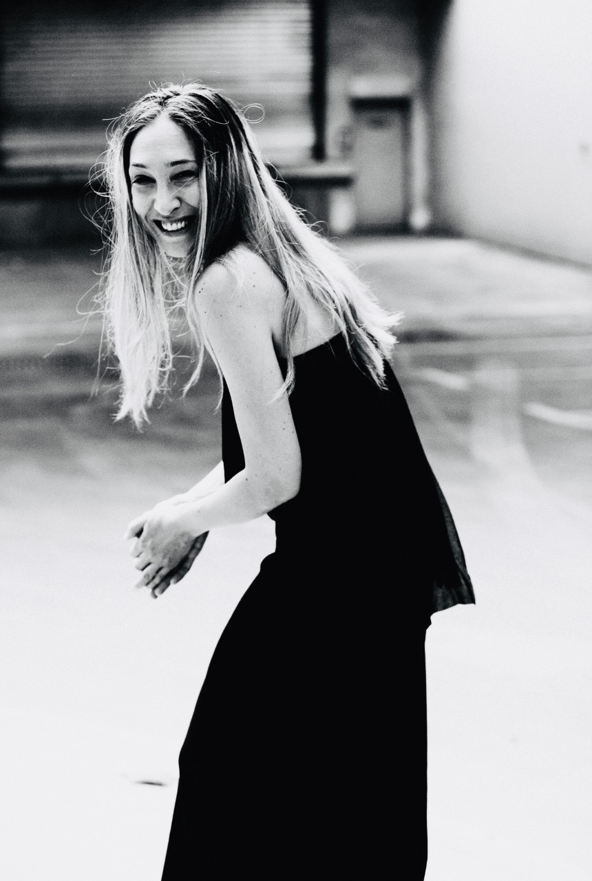 Tanja in a black dress smiling